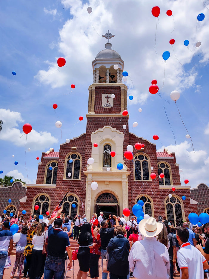 people in front of brown and white cathedral under cloudy sky during daytime